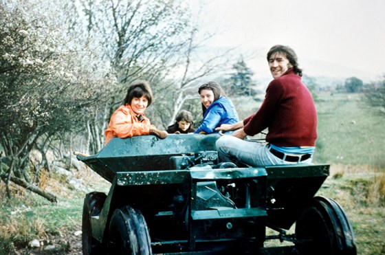 Brian driving the dumper at Helygog, North Wales, 1970s, with Maureen, Dot, and Linda (photo from Dot & Ron)