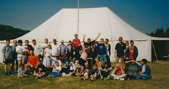 IMG 20210120 0005 -16th/23rd Southend on sea annual camp Whitecliff Bay I.o.W. Peter and Joyce surrounded by happy well fed campers whom they catered for for the whole week!