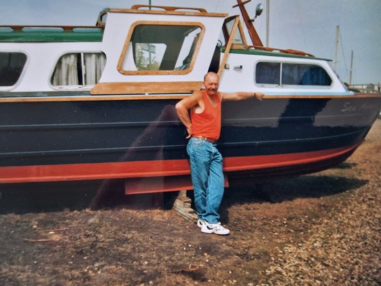 Fred next to boat at Woodbridge x