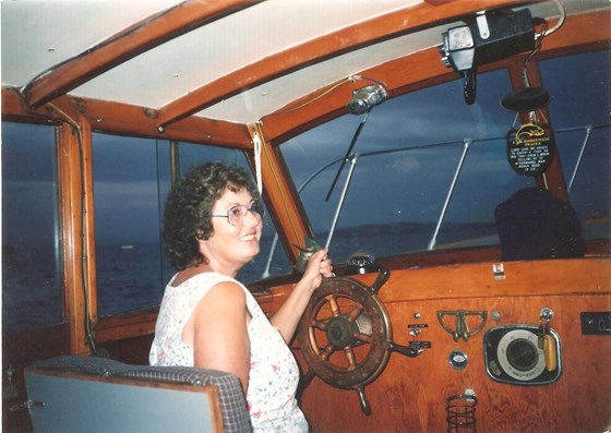 Barbara Ann driving the boat named after her (the Barbara Ann)