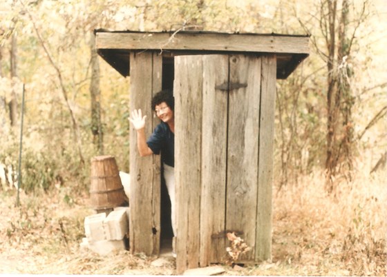 Barb at an outhouse in Alabama (georges)