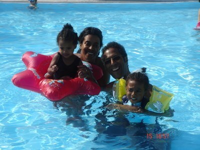 angi, Naomi, mummy and daddy swimming