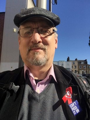 Simon wearing a red ribbon for World Aids Day 2017