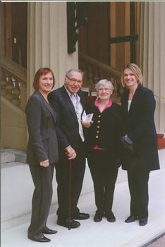 Receiving his MBE with Anna and two daughters