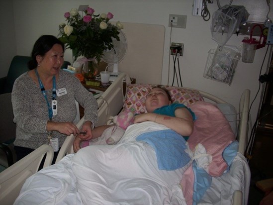 Elise on the last day she was awake, with VGH Childlife Specialist, Theresa Low.