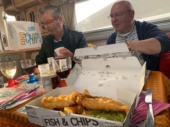 Brothers enjoying fish and chips 