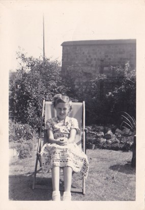 Jo as a schoolgirl in the garden at Reading at her grandparents