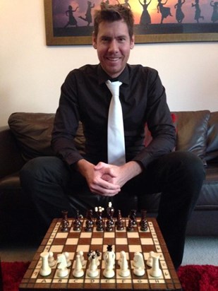 Ben teaching me how to play chess. He got dressed up especially! 26 Jan 2014.  Jaz.