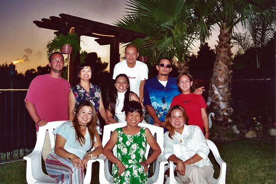Auntie Baby at a family get-together in 2003 with Elena, Naomi, Eric, Emily, Felisa, Ruel, Evan, and