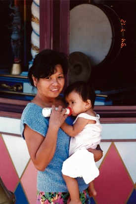 Auntie Baby holding Rachel at Disneyland, 1994