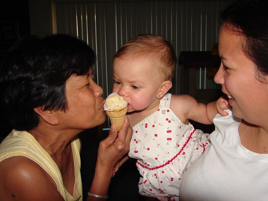 Auntie sharing a cone cupcake with Olivia and Donna July 2009