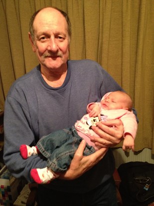 Grandad holding his great granddaughter sophie