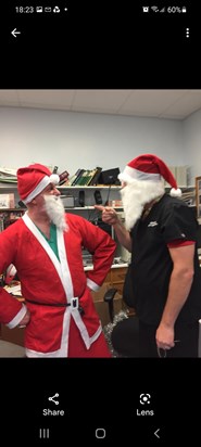 Steve having a "Santa off" with the former Head of Department