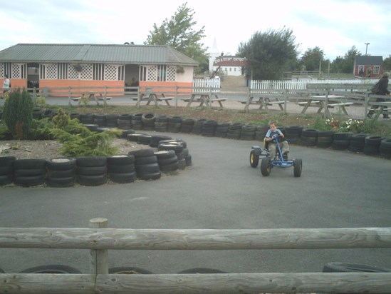 Pedal power! Nathan racing round the go-kart track.