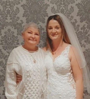 Stacey and you with her wedding dress … you were sorely missed on her special day 28/5/2022