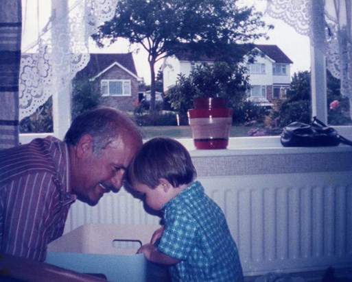Proud Grandad playing with his first Grandchild - James c. 1986