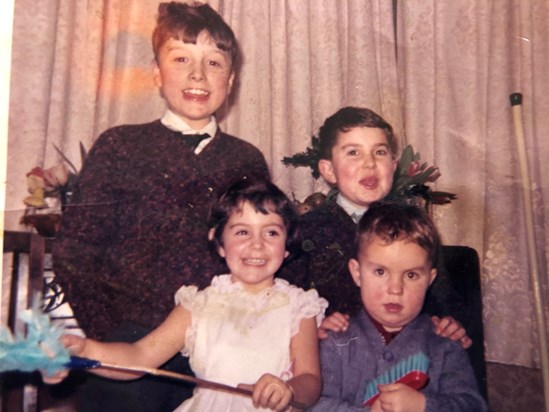A Christmas/New Year party 'down home'.  Pictured are the cousins - Peter, Jeffrey, myself (Gill) and of course John.  Circa 1964/5?