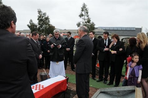 Priest at Grave