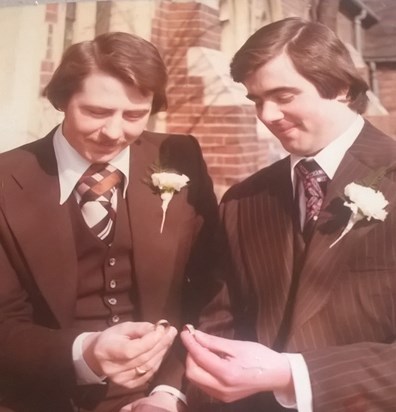 looking at the rings with his best man, Steve Gill