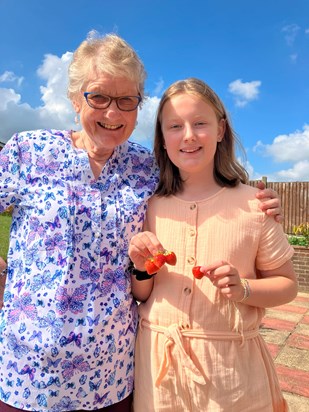 Sharing the fruits of her garden with granddaughter Melody, September 2023