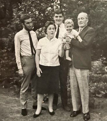 With his father (Ross), mother (Mary), brother (Edwin) and son