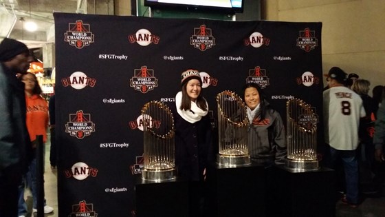 2015 06 02 Dorothy and Sophia posing with the Giants championship trophies