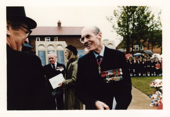 Leonard Cheshire wearing his medals.