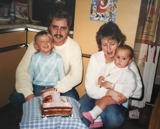 My 1st birthday with Mum, Dad, Kayley and me! And a cake made by Mum