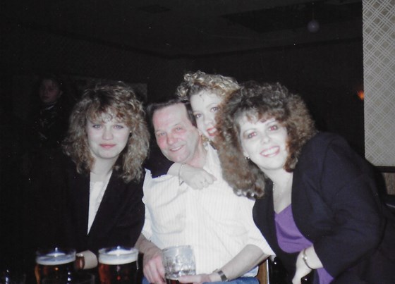 Dad with his girls sometime in the 80s