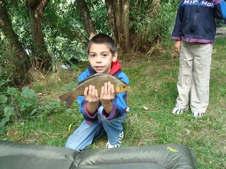 Conner with carp, that he caught when fishing.