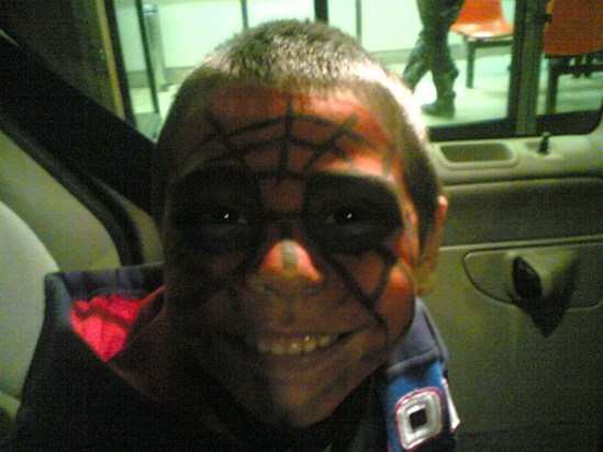 Conner with face painted as spider web,when he was 5 years old.