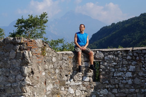 Sitting on the walls at Castello dell'Innominato.