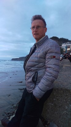 Gwil on the beach at Watergate Bay on a stormy afternoon