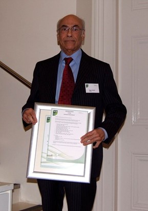 rajan with his award for meritorious achievement from the BCS