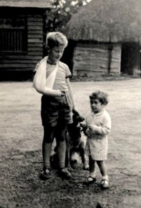 Michael aged 10 with me aged 2 in our grandfather Cheyney’s yard. Michael was a hero cousin we looked up to.  Love from Ruth