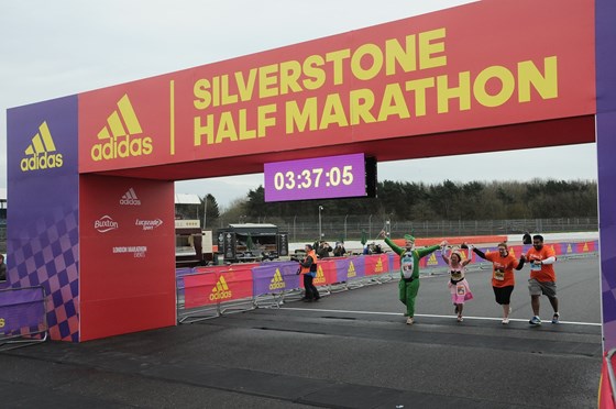 March 2017 Silverstone Half Marathon team crossing the finish line