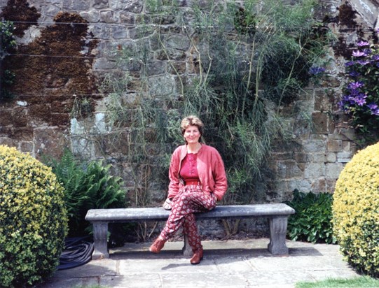 Sitting pretty: Patricia takes a seat in the gardens at Chatwell