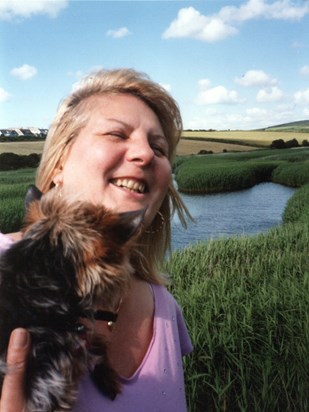 Beloved pet: Yorkshire Terrier Bertie with Patricia by the Cuckmere River in Alfriston, Sussex