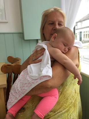 Baby love: Pat gives Jovi Dawson a shoulder to sleep on