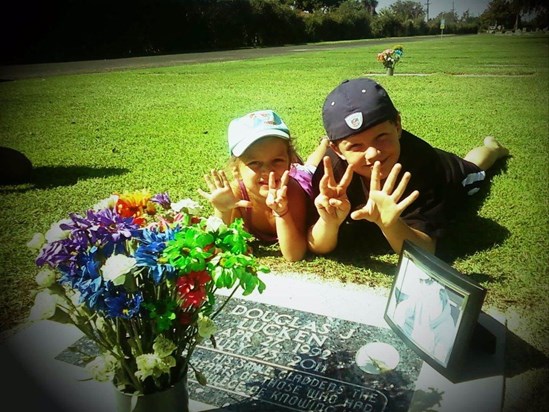 Dj's two lil cousins Brandon and Ciara holding up 88 for Djs fav NASCAR driver Dale Jr (graveside)