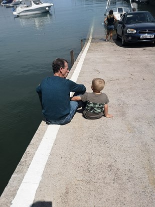 Jacob sat with his poppa getting told how this is where we use to always launch our boats