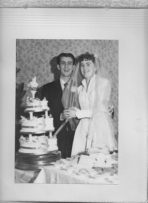 Mum & Dad cutting their Wedding cake