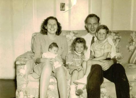 Joan and Chester with Carol, Kenny, and Baby Taffy in the Toccoa steel house about 1945