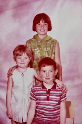 Alan with his sisters at primary school