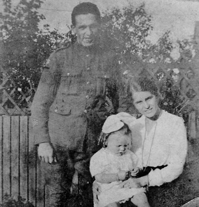 Doris at two years old with her parents 1918
