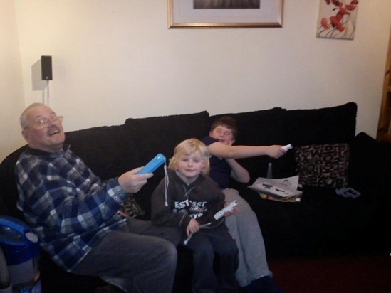 Playing the Wii with his two favourite boys
