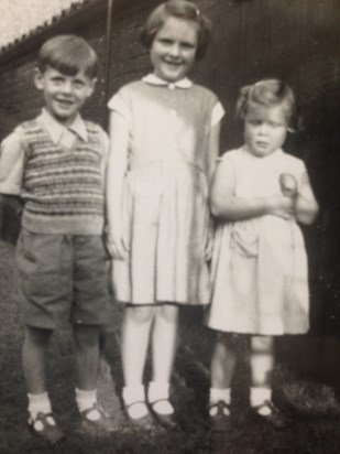 With brother David and sister Liz, in their garden on Clay Road, Caister.