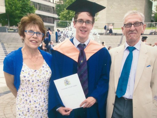 Lewis at his graduation, flanked by two proud parents. Judy beautifully co-ordinated, as ever.