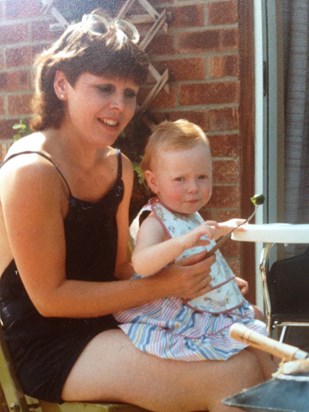 I like this photo of Judy, glasses on head so you could see her beautiful eyes, feeding Ruth .