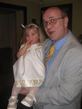 Annabelle in Grandad's arms at her Christening, March 2009